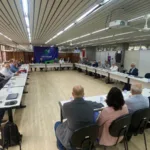 a group of people sitting at tables in a room
